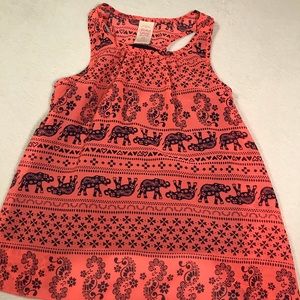 A bright pink and navy blue elephant shirt